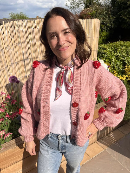 Customer review photograph in a pink strawberry cardigan