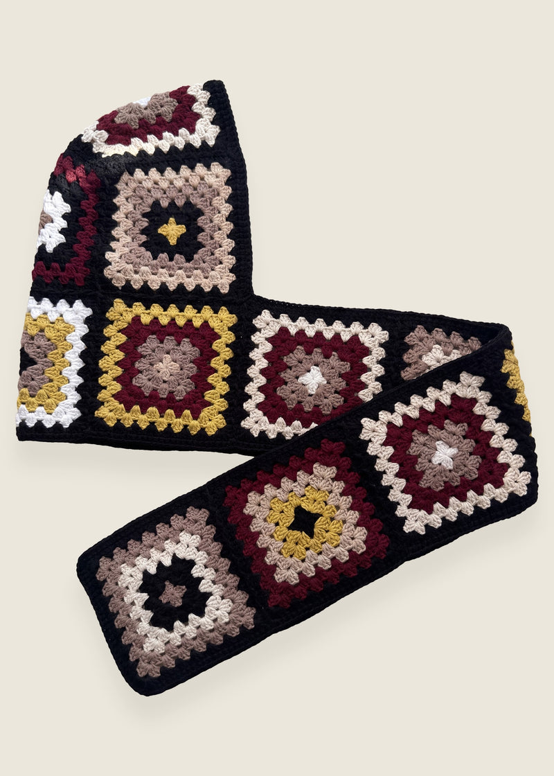 Black granny-square crochet hooded scarf laid flat, hood and long scarf in one piece — handmade by Ana Chic