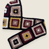 Black granny-square crochet hooded scarf laid flat, hood and long scarf in one piece — handmade by Ana Chic