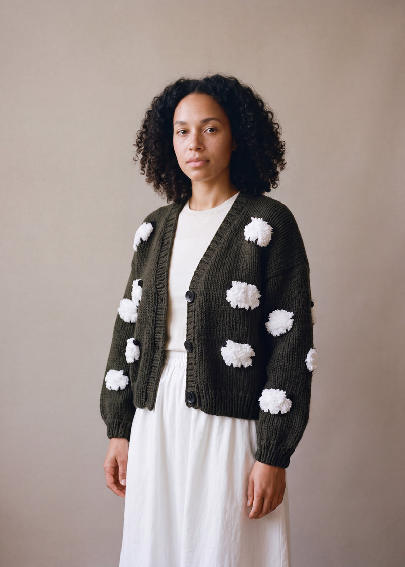 Sheep Hand Knitted Cardigan - very dark olive green chunky hand-knitted wool cardigan with crocheted motifs, worn open over a plain top by Ana Chic