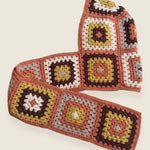 Terracotta granny-square crochet hooded scarf laid flat, hood and long scarf in one piece — handmade by Ana Chic