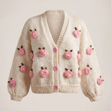 Rose Cream cardigan front — cream chunky hand-knitted wool cardigan with crocheted pink roses and pink buttons, handmade by Ana Chic
