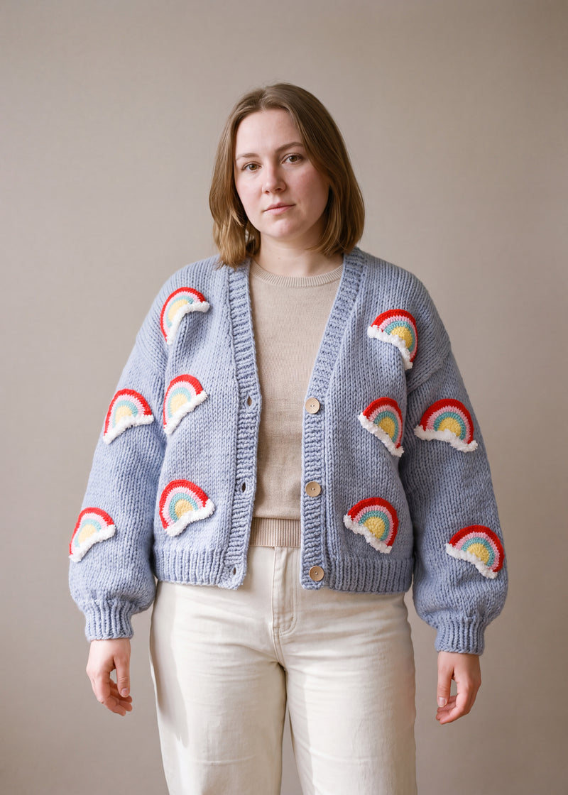 Cloud Nine - powder blue chunky hand-knitted wool cardigan with crocheted motifs, worn open over a plain top by Ana Chic