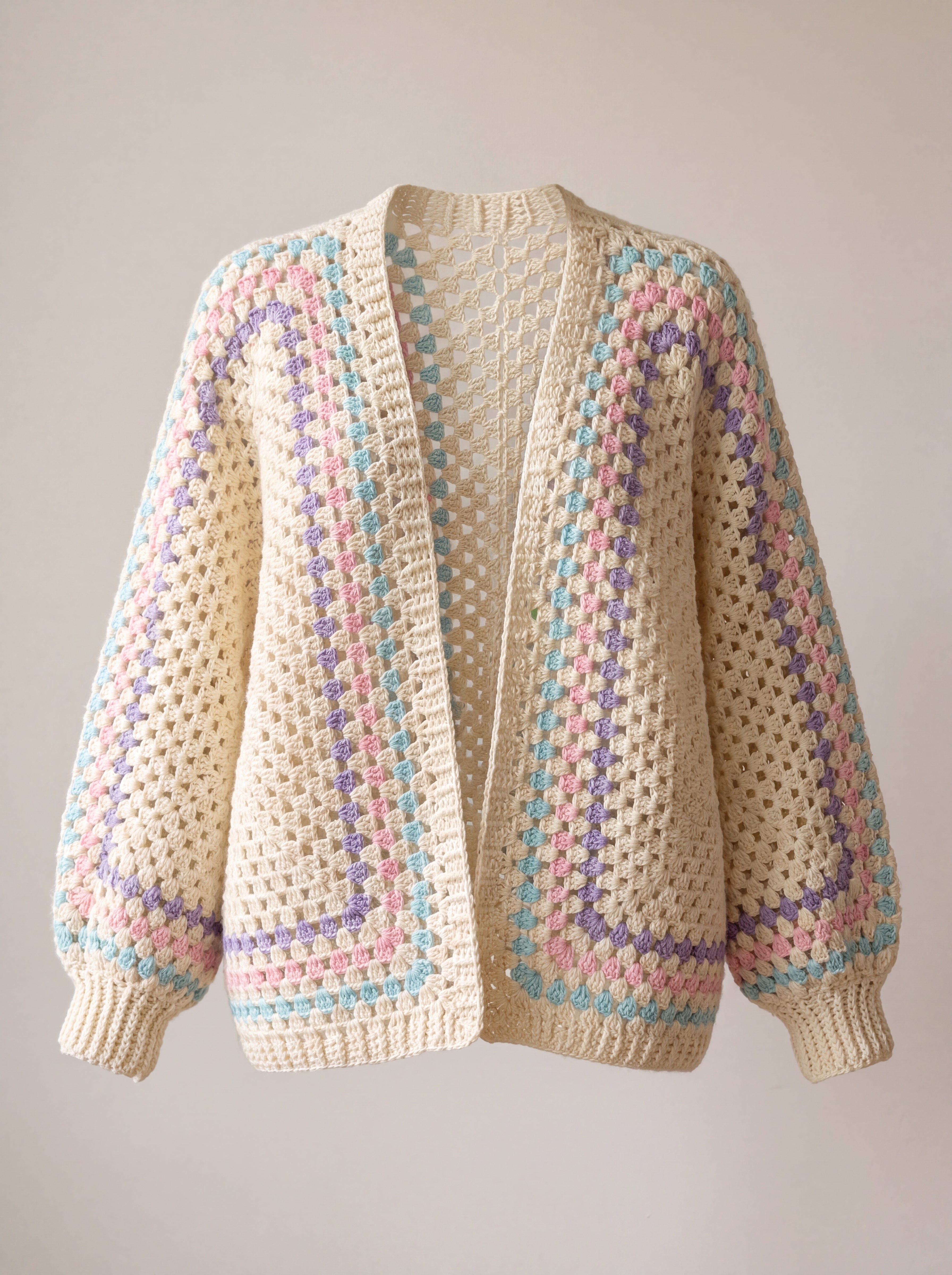 Ecru hexagon crochet cardigan with lilac, baby pink and turquoise stripes and wide batwing sleeves, front view - handmade by Ana Chic