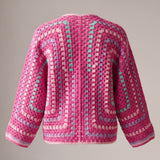 Back of a hot pink hexagon crochet cardigan, two granny hexagons meeting at the centre back - handmade by Ana Chic