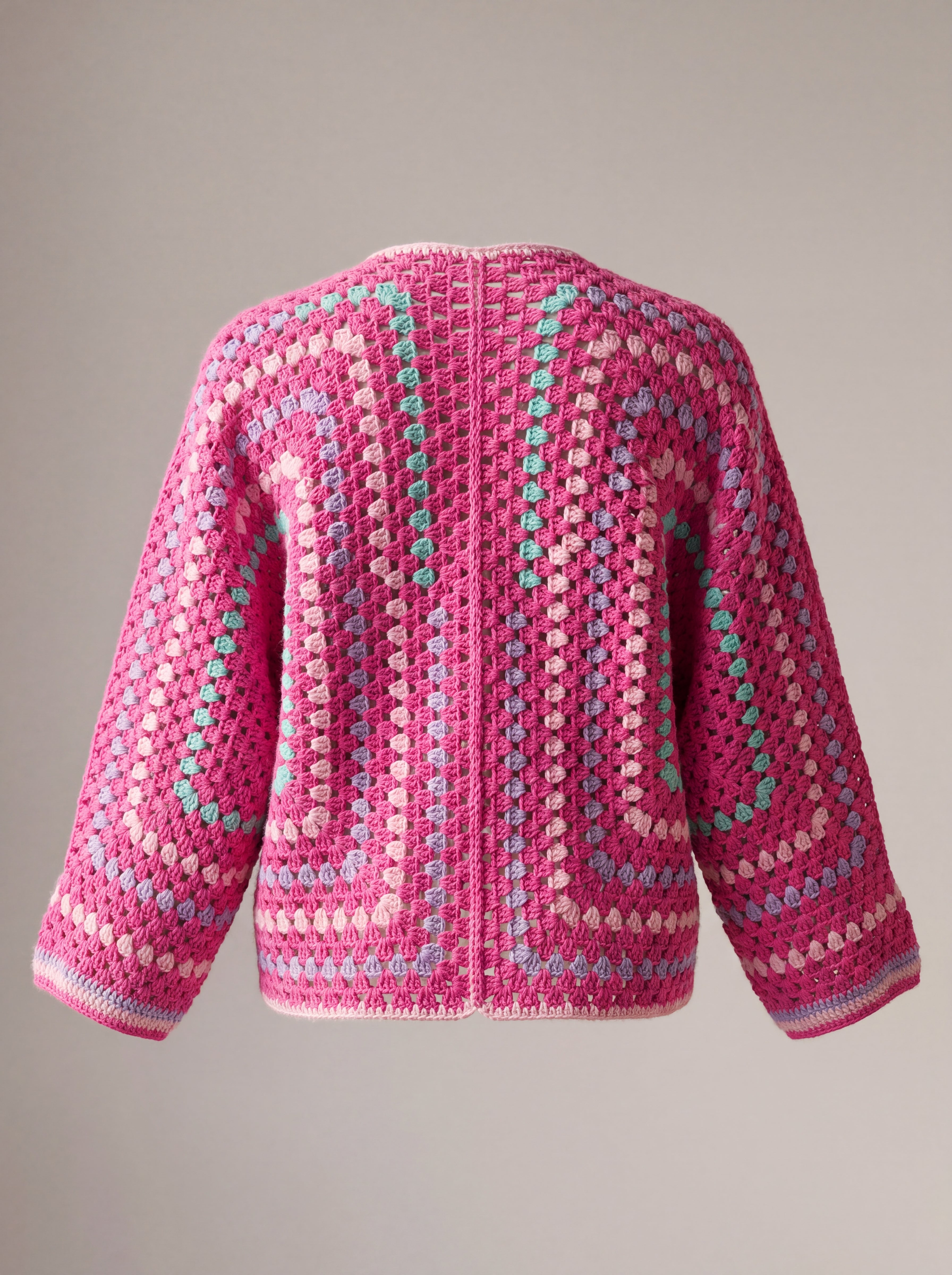 Back of a hot pink hexagon crochet cardigan, two granny hexagons meeting at the centre back - handmade by Ana Chic