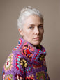 Close-up of the Patchwork Crochet Sweater in Purple, hand-crocheted granny square stitch detail