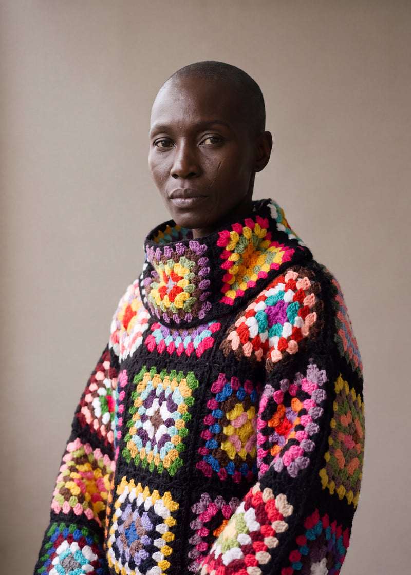 Close-up of the Patchwork Crochet Sweater in Black, hand-crocheted granny square stitch detail