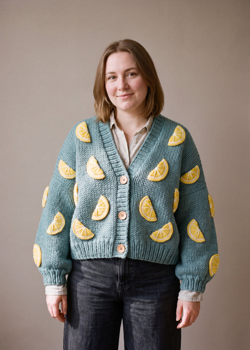 Lemon Slices  – Chunky Wool Hand-Knitted Cardigan - soft sea-green teal chunky hand-knitted wool cardigan with crocheted motifs, worn open over a plain top by Ana Chic
