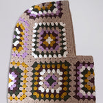Sand and lilac granny square balaclava laid flat, side view of the hood — handmade by Ana Chic