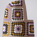 Sand and lilac granny square balaclava laid flat, side view of the hood — handmade by Ana Chic