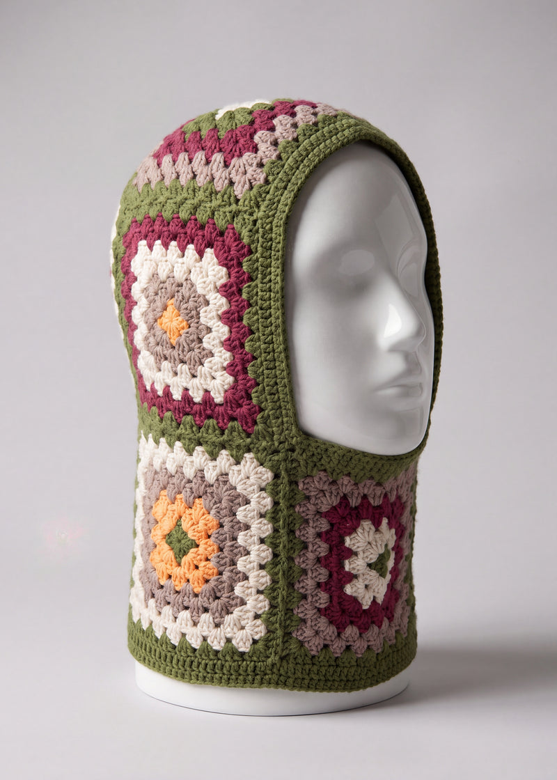 Olive green granny square balaclava on a display head, open face and deep neck section — handmade by Ana Chic
