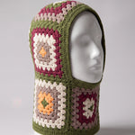 Olive green granny square balaclava on a display head, open face and deep neck section — handmade by Ana Chic
