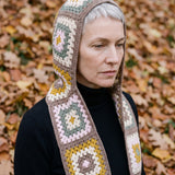 Mocha granny-square crochet hooded scarf worn with the hood up and the tails down the front — handmade by Ana Chic