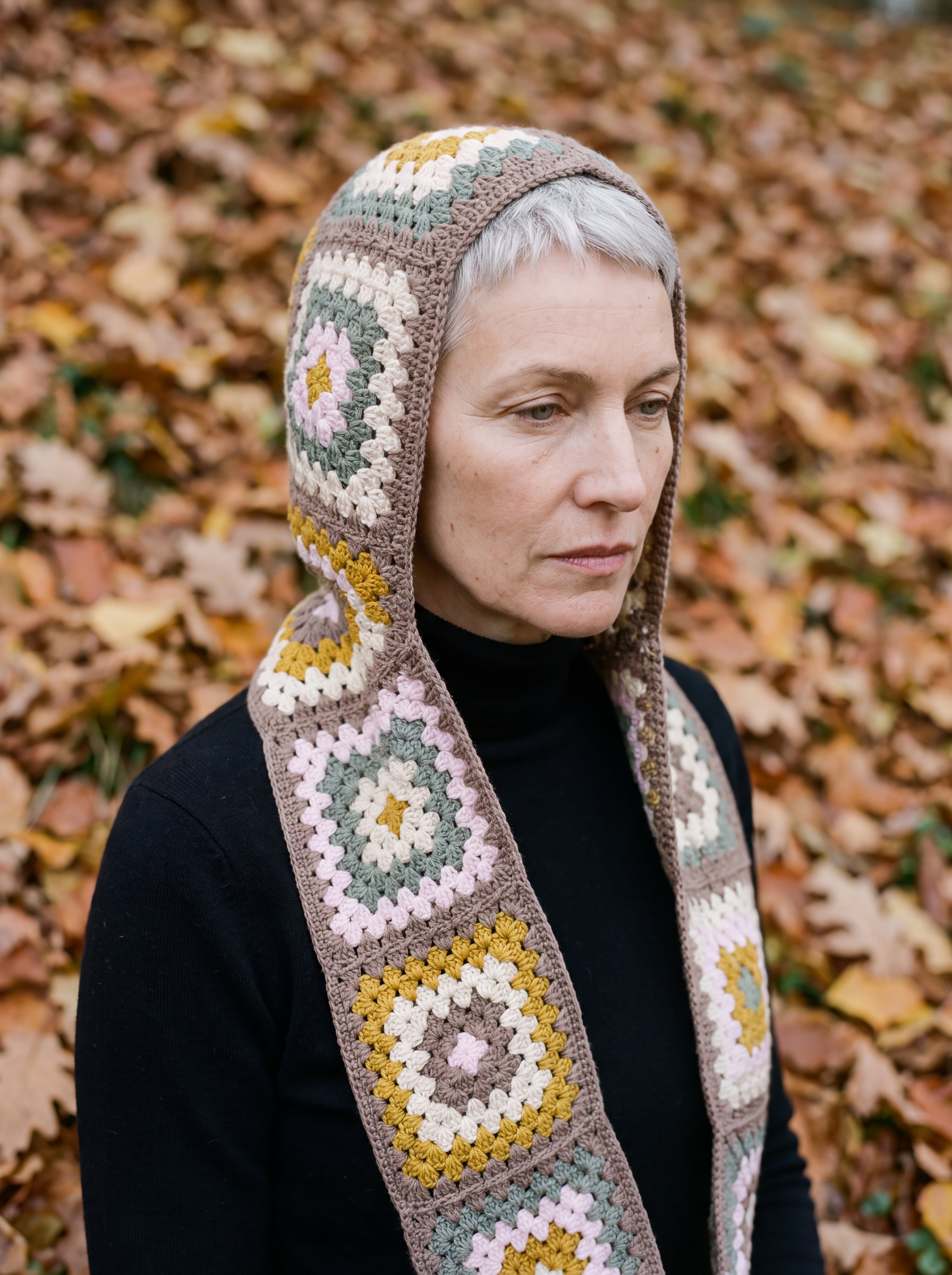 Mocha granny-square crochet hooded scarf worn with the hood up and the tails down the front — handmade by Ana Chic