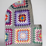 Sage multicolour granny square balaclava laid flat, side view of the hood — handmade by Ana Chic