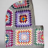 Sage multicolour granny square balaclava laid flat, side view of the hood — handmade by Ana Chic