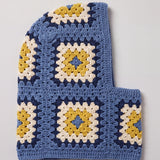 Denim blue and mustard granny square balaclava laid flat, side view of the hood — handmade by Ana Chic