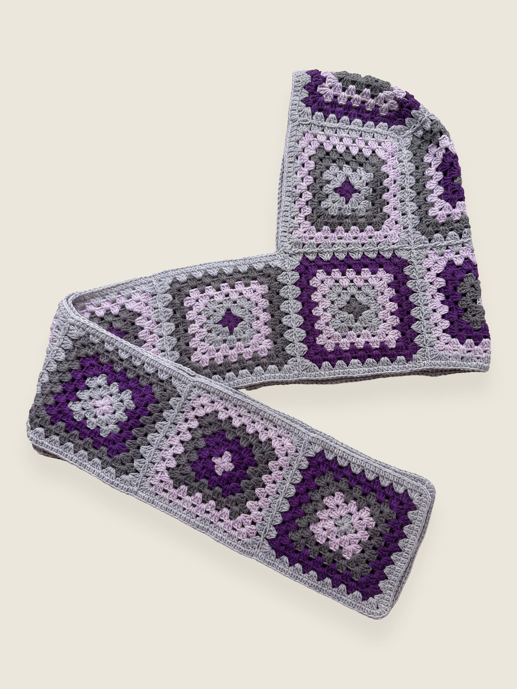 Grey granny-square crochet hooded scarf laid flat, hood and long scarf in one piece — handmade by Ana Chic
