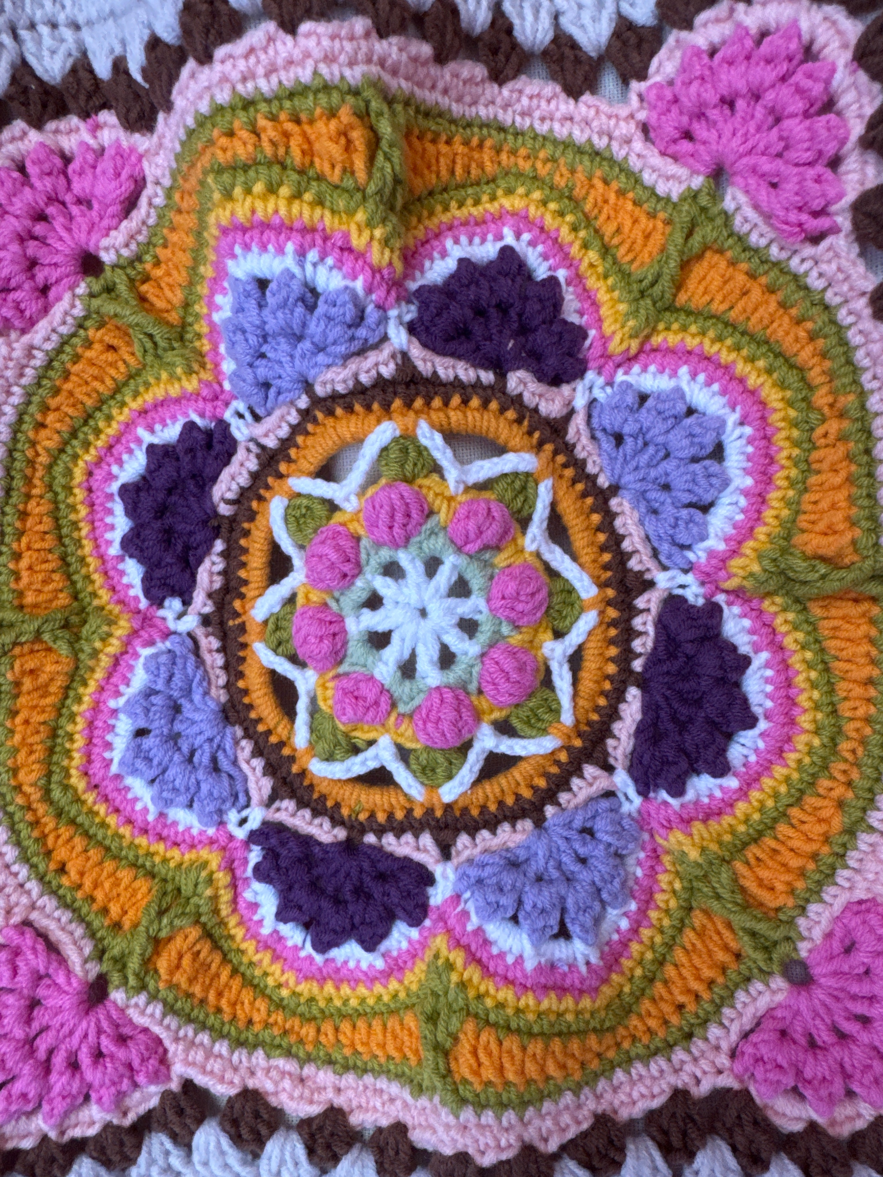 Close-up of the crocheted medallion on the pink crochet tote bag — handmade by Ana Chic