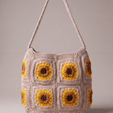 Back of the beige crochet crossbody bag with its sunflower squares and adjustable strap — handmade by Ana Chic