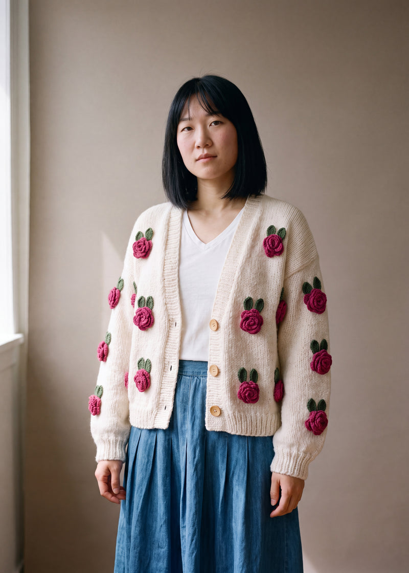 Pink Rose Knit Cardigan - cream chunky hand-knitted wool cardigan with crocheted motifs, worn open over a plain top by Ana Chic