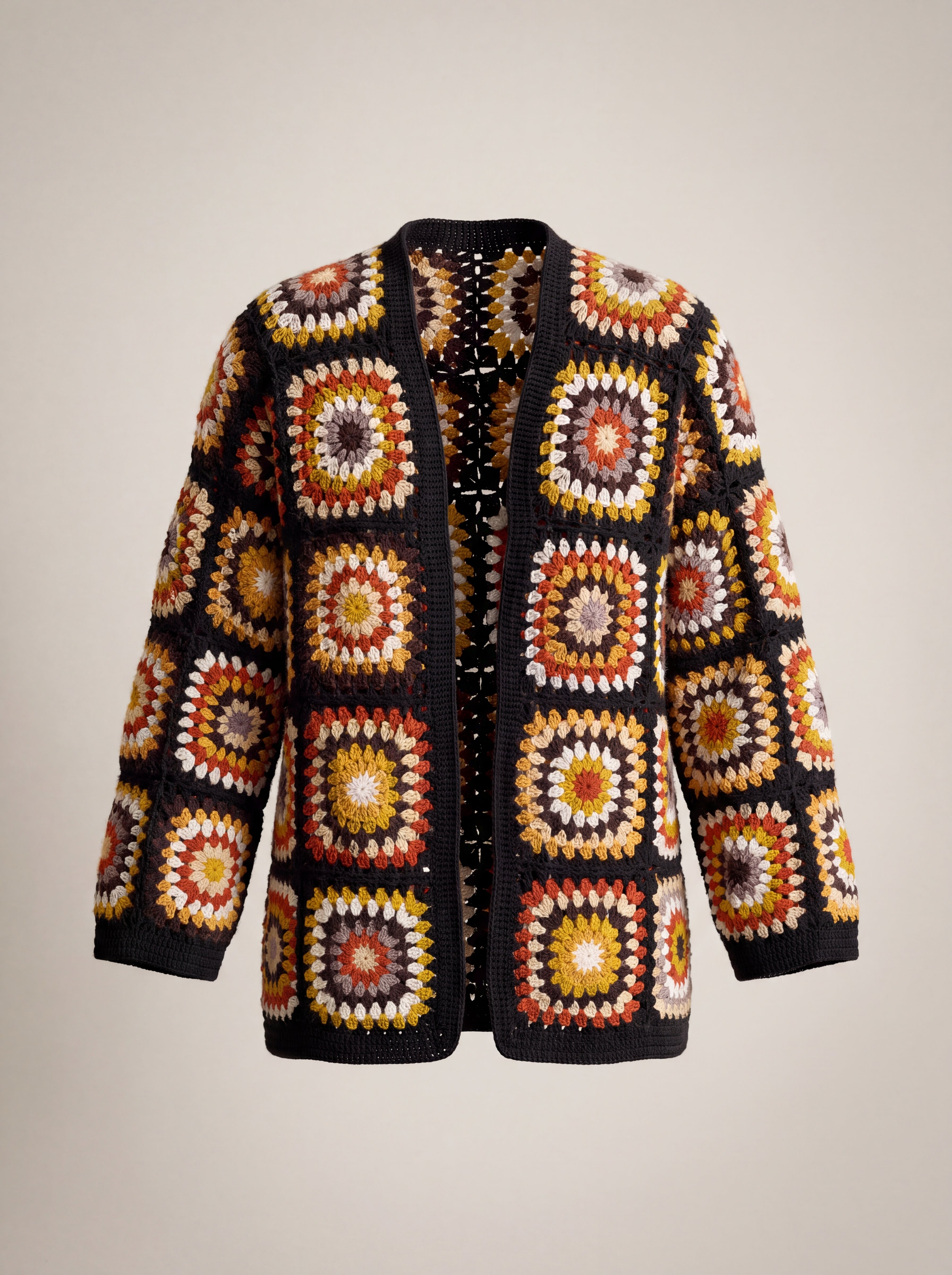 Black Boho Cardi front, open granny-square crochet cardigan in rust, mustard and cream