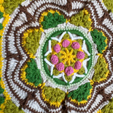 Close-up of the crocheted medallion on the green crochet tote bag — handmade by Ana Chic