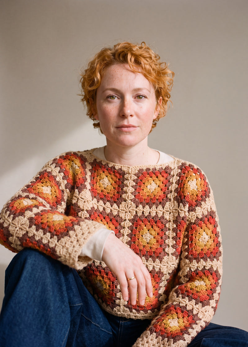 Rust granny square crochet jumper worn with dark denim, close view of the crochet grid — handmade by Ana Chic