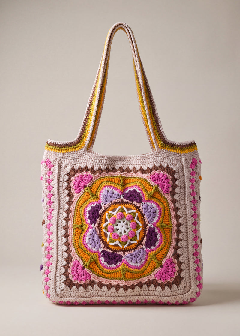 Front of the pink crochet tote bag with its raised crocheted medallion — handmade by Ana Chic