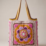 Front of the pink crochet tote bag with its raised crocheted medallion — handmade by Ana Chic
