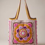 Front of the pink crochet tote bag with its raised crocheted medallion — handmade by Ana Chic