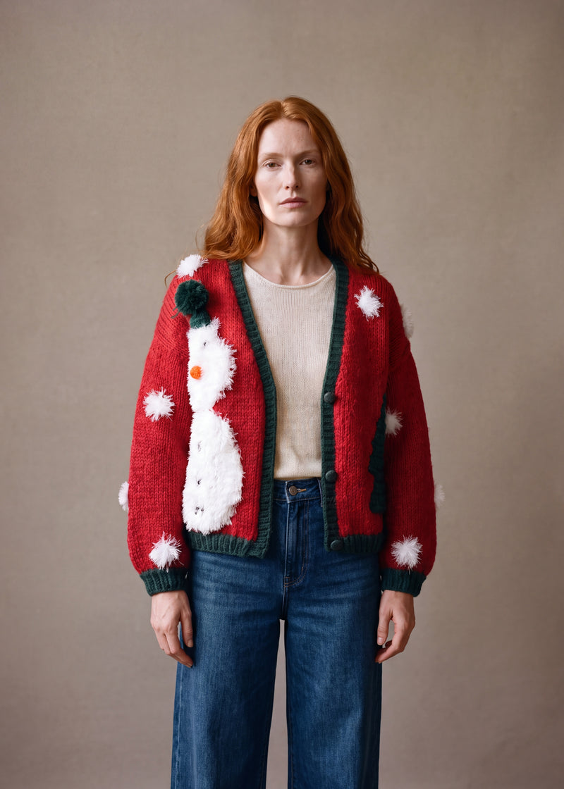 Christmas Snowman Cardigan - bright red chunky hand-knitted wool cardigan with crocheted motifs, worn open over a plain top by Ana Chic