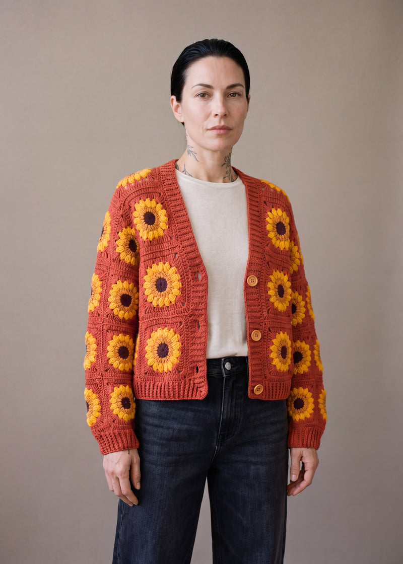 Crop Sunflower Cardigan - Rust - Terracotta/brick squares crocheted granny square cardigan with raised crochet sunflowers, worn by Ana Chic