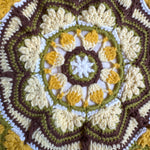 Close-up of the crocheted medallion on the mustard crochet tote bag — handmade by Ana Chic