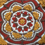 Close-up of the crocheted medallion on the rust crochet tote bag — handmade by Ana Chic