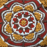 Close-up of the crocheted medallion on the rust crochet tote bag — handmade by Ana Chic