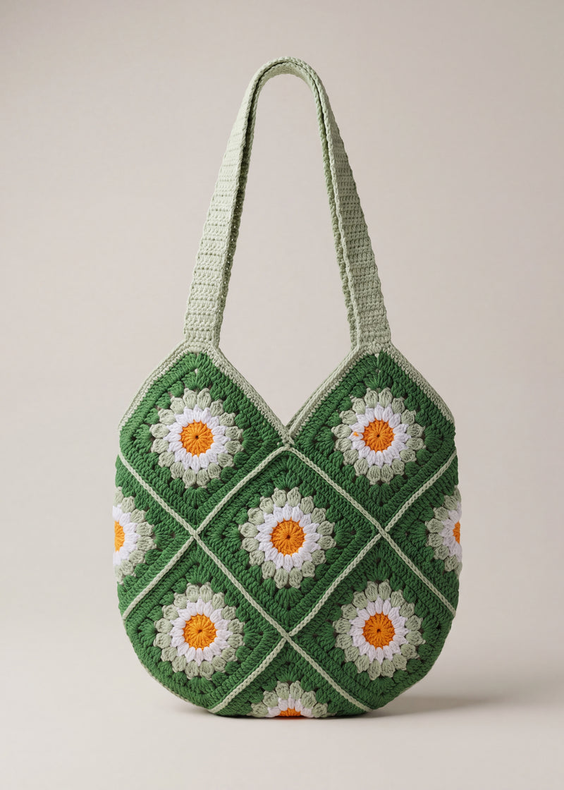 Front of the green crochet shoulder bag with daisy granny squares and two sage-green straps — handmade by Ana Chic