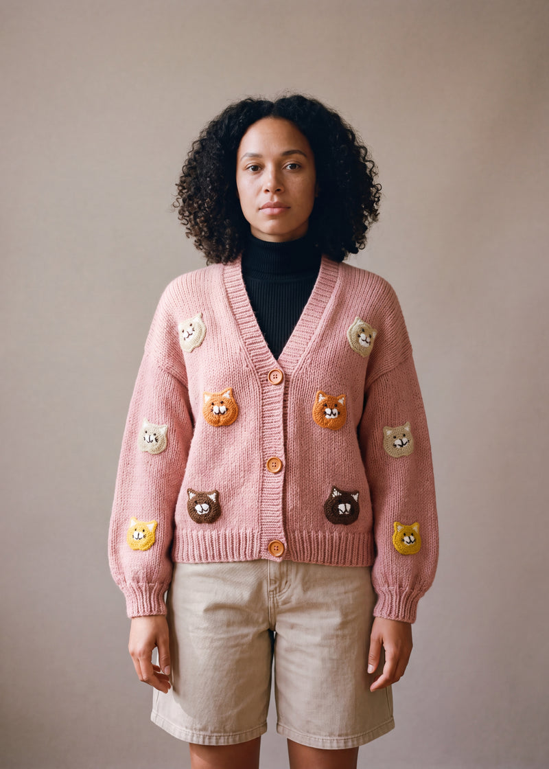 Cat Cardigan - soft pink chunky hand-knitted wool cardigan with crocheted motifs, worn open over a plain top by Ana Chic