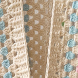 Close-up of the open front edge of an ecru hexagon crochet cardigan, granny clusters and turquoise stripe - handmade by Ana Chic