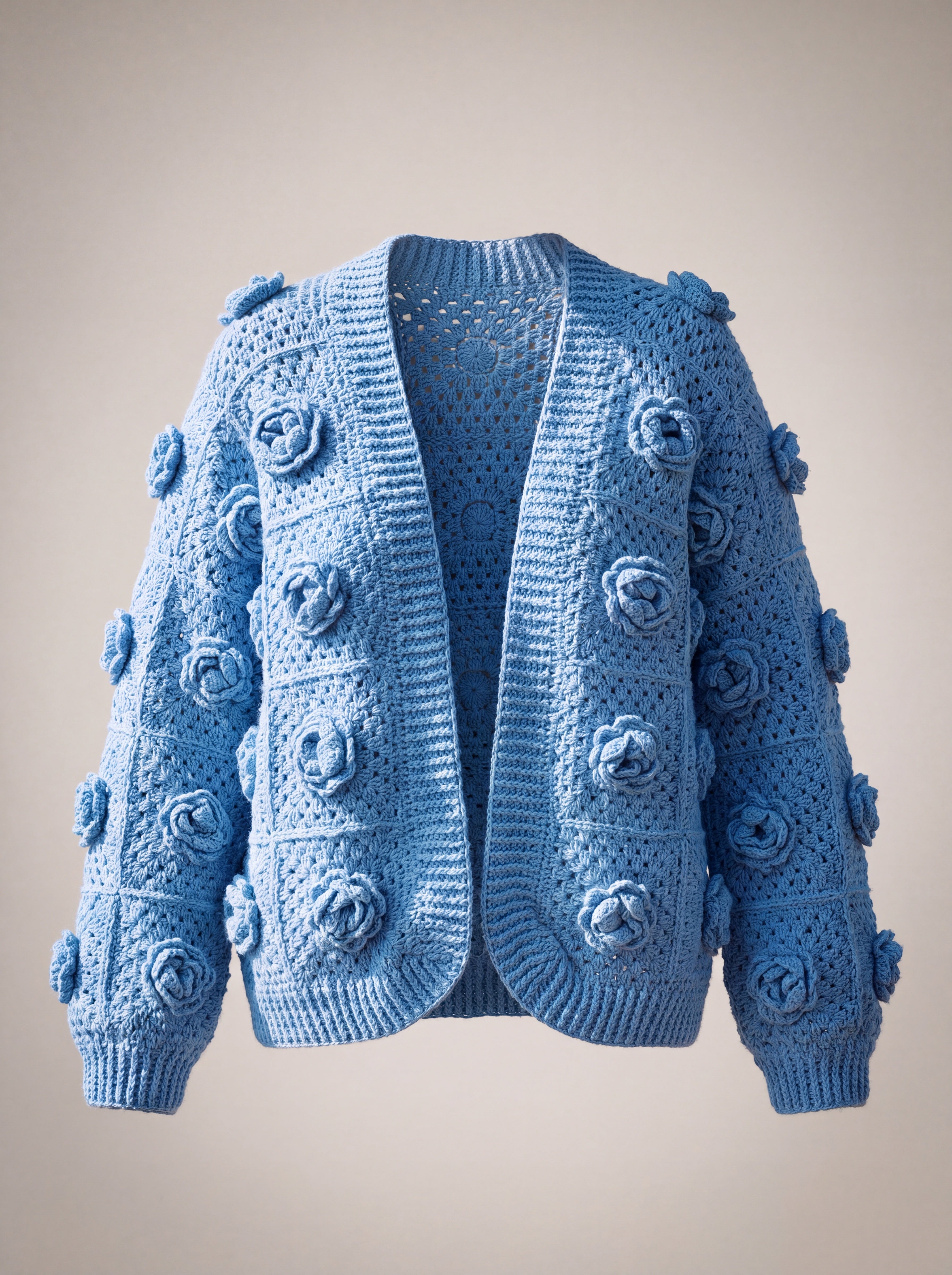 Cornflower blue granny square cardigan with a raised crochet rose on every square, front view — handmade by Ana Chic