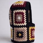Black and burgundy granny square balaclava standing on its own, back view of the hood — handmade by Ana Chic