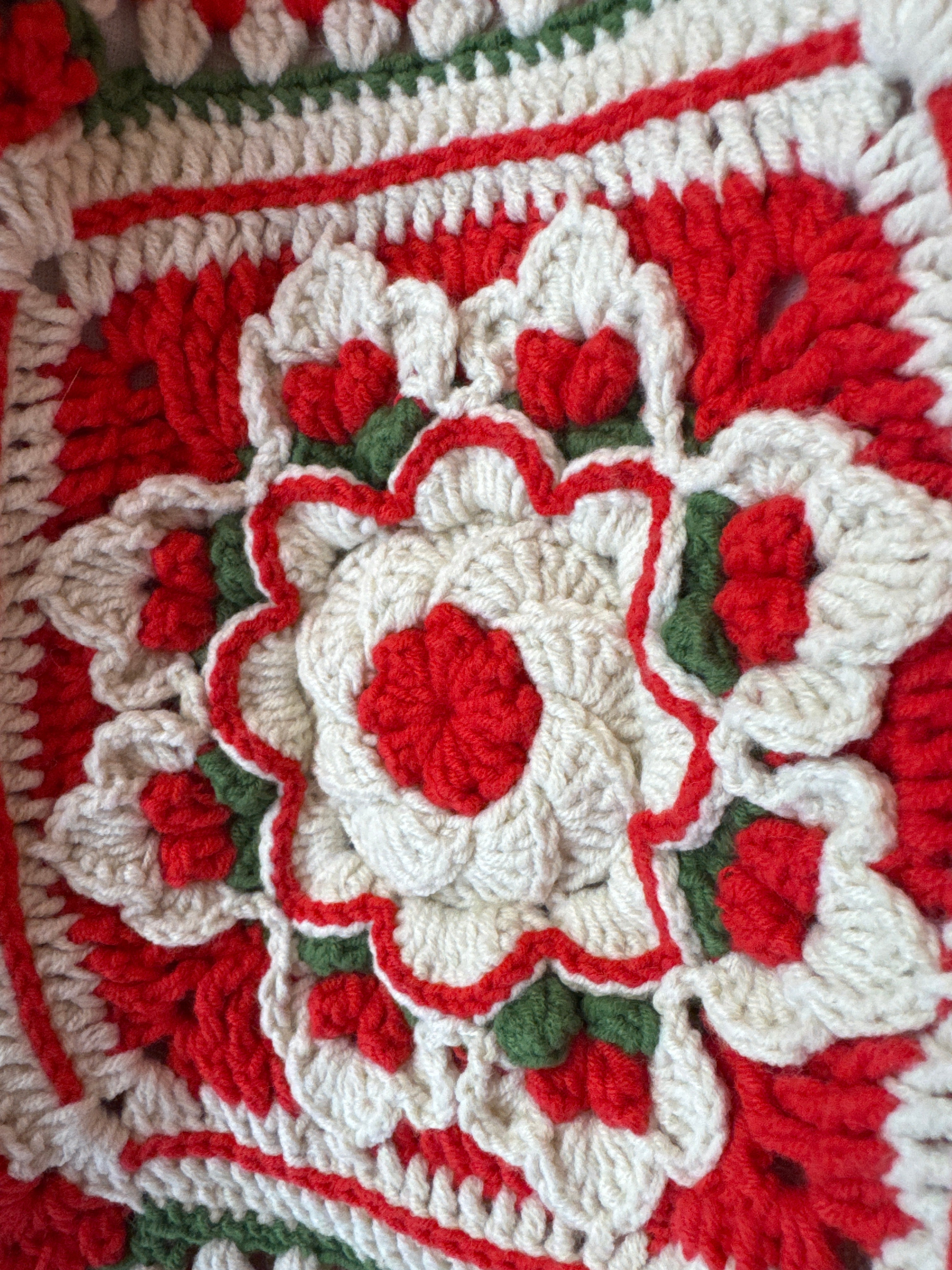 Close-up of the crocheted medallion on the red crochet tote bag — handmade by Ana Chic
