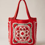 Front of the red crochet tote bag with its raised crocheted medallion — handmade by Ana Chic