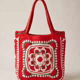 Front of the red crochet tote bag with its raised crocheted medallion — handmade by Ana Chic