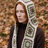Cream granny-square crochet hooded scarf worn with the hood up and the tails down the front — handmade by Ana Chic