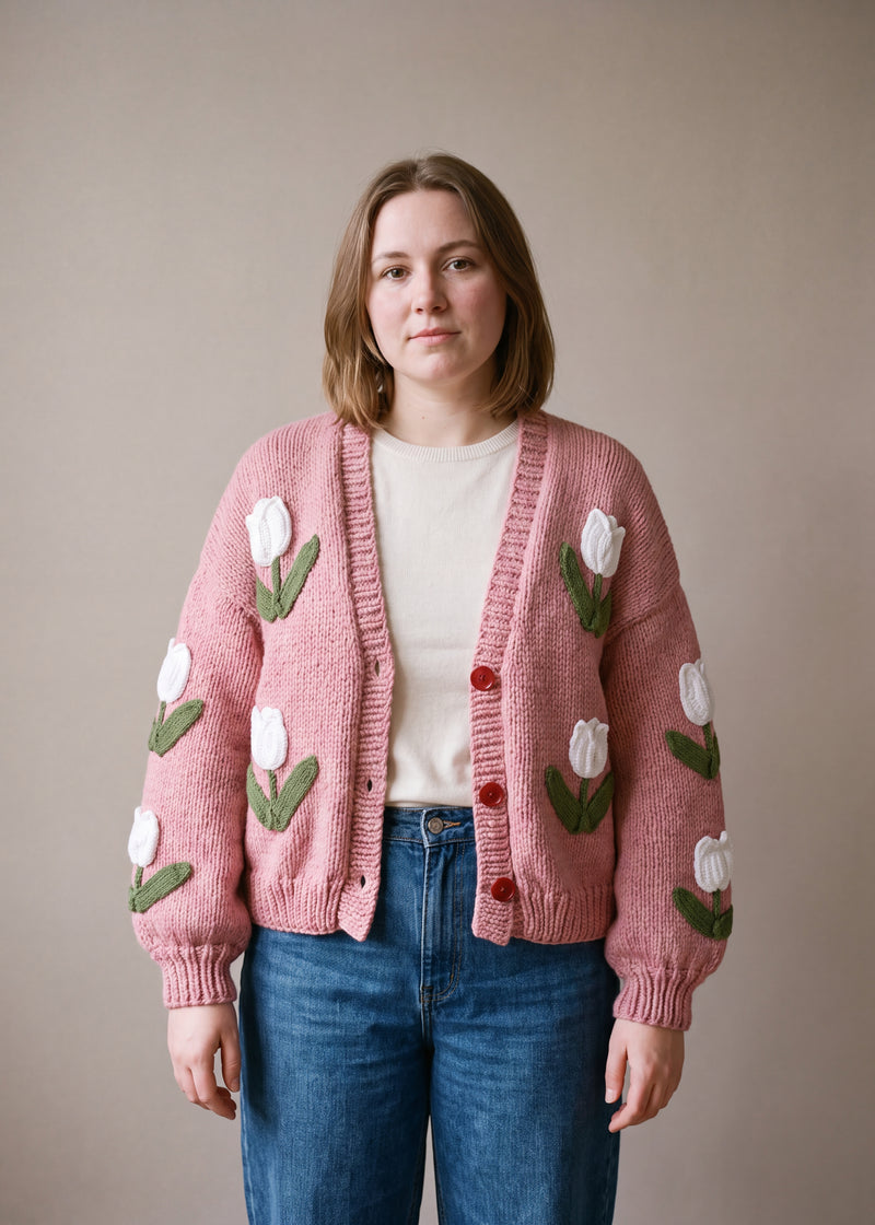 Pink Tulip Cardigan - dusty rose pink chunky hand-knitted wool cardigan with crocheted motifs, worn open over a plain top by Ana Chic