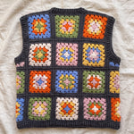 Multicolour granny square crochet vest, back, laid flat on linen
