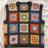 Multicolour granny square crochet vest, front, laid flat on linen