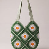 Back of the green crochet shoulder bag with its daisy granny squares and two shoulder straps — handmade by Ana Chic
